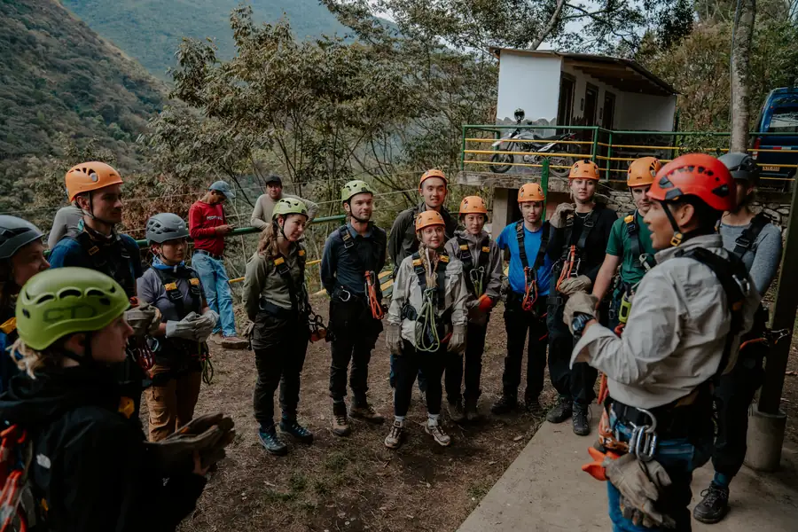 Guides giving the safety briefing to a group in Lucmabamba